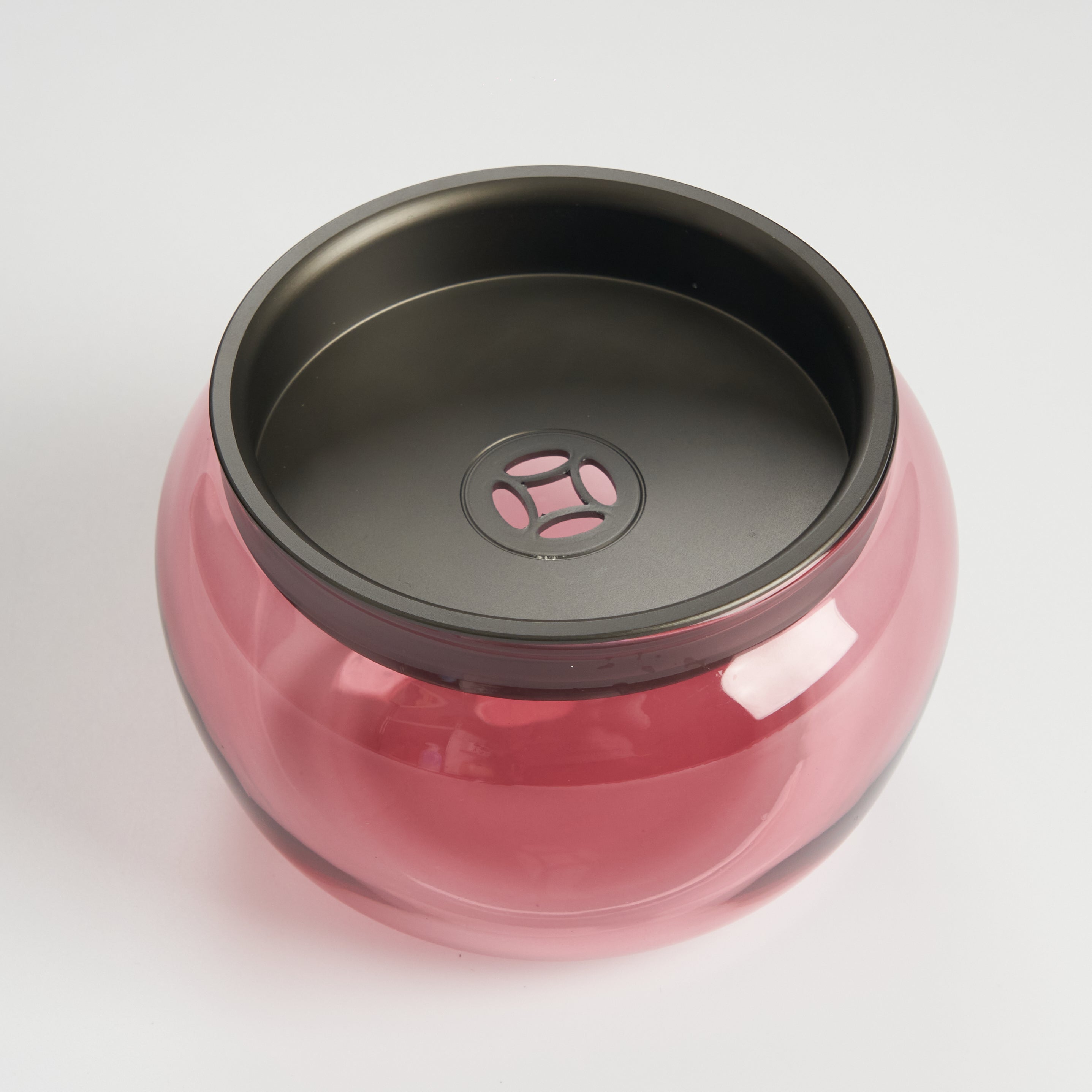 Translucent pink bowl dark lid