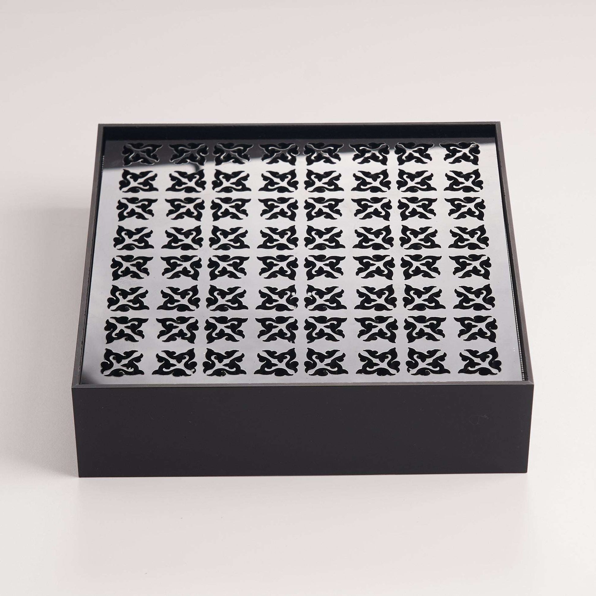 Minimalist black acrylic tea tray designed for practical daily tea brewing