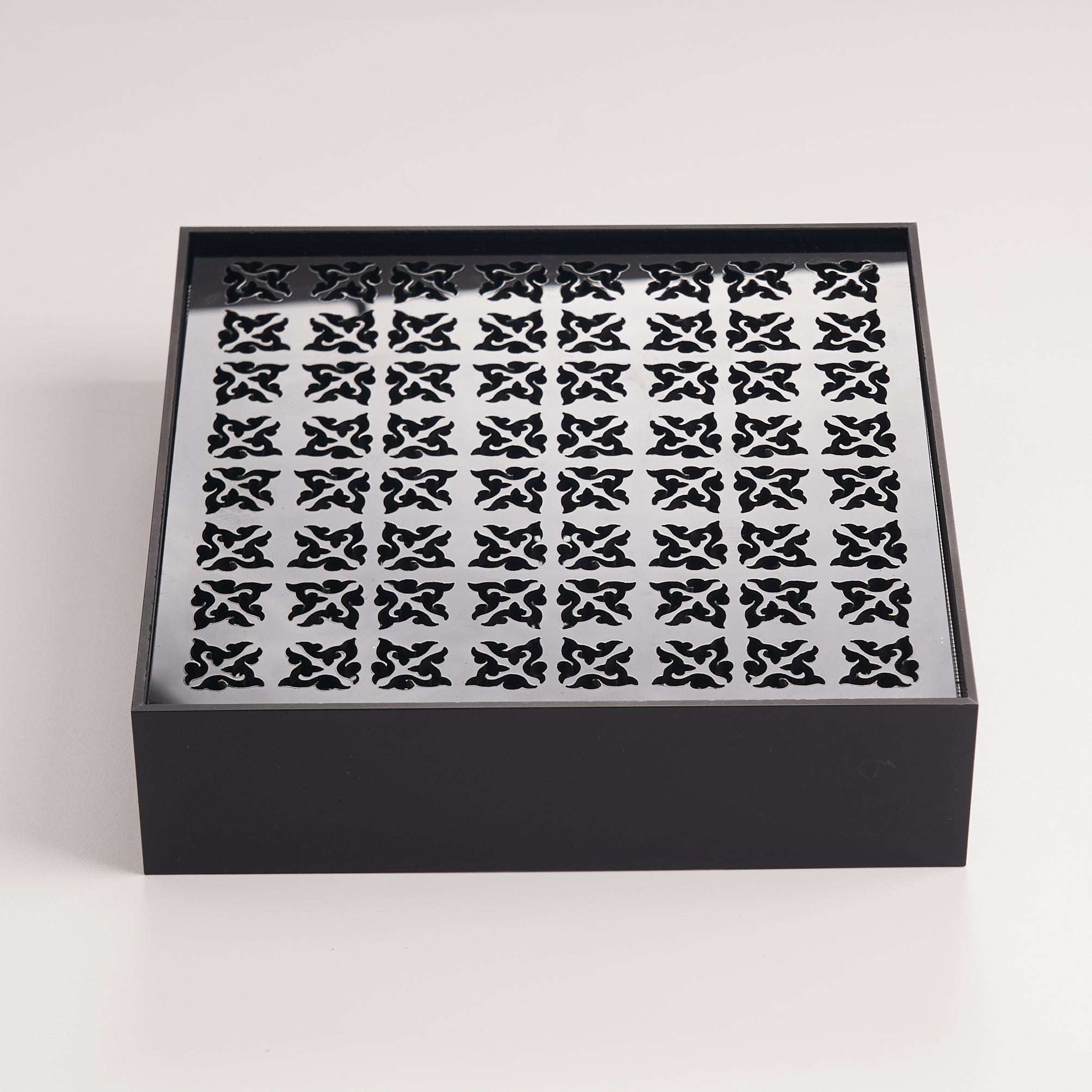 Minimalist black acrylic tea tray designed for practical daily tea brewing