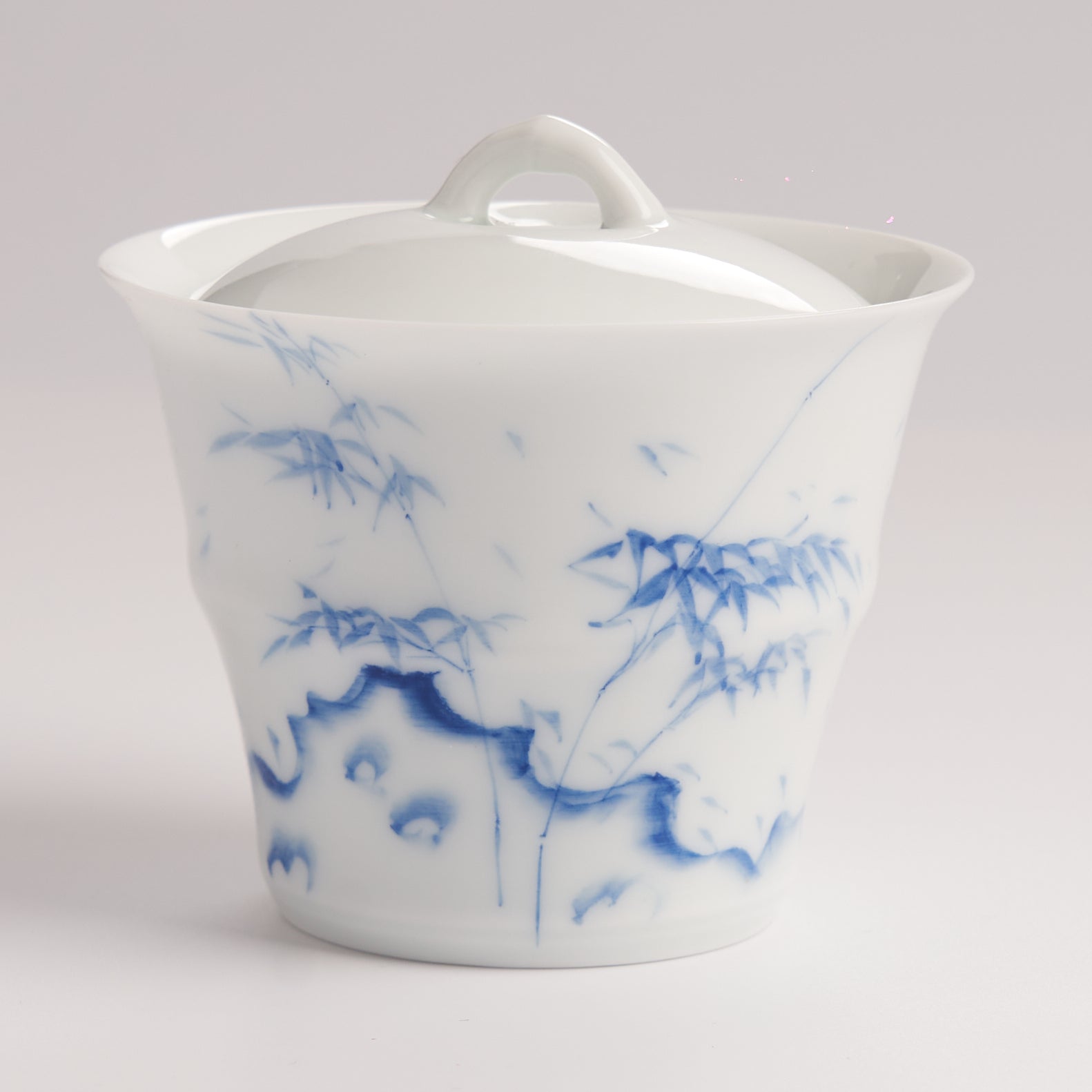 White porcelain gaiwan with hand-painted blue brushwork and flared rim