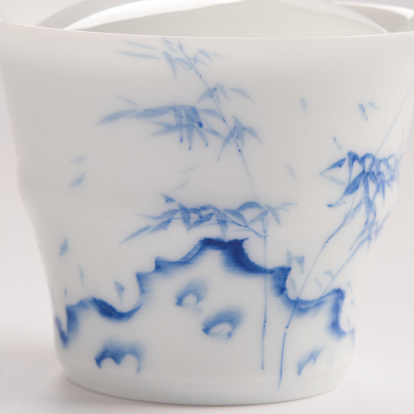 Blue brush bamboo and landscape details on white porcelain gaiwan