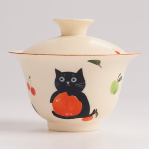 Ceramic bowl with a black cat design on a white background