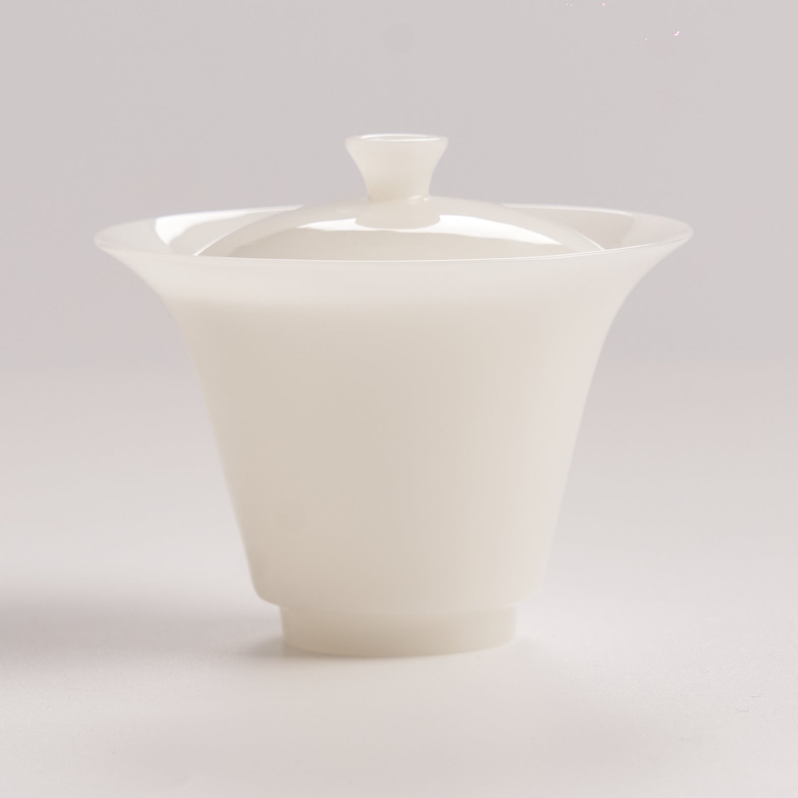 White jade like gaiwan with lid on a light gray background