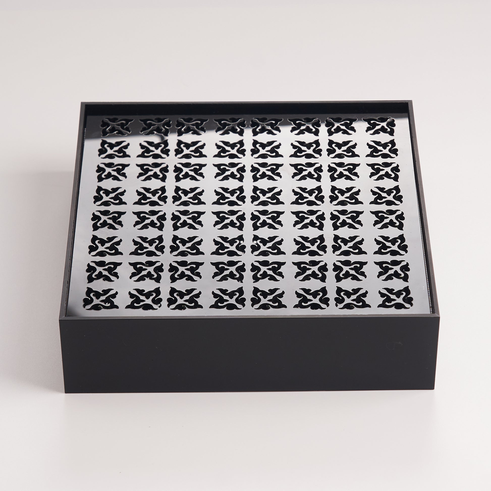 Minimalist black acrylic tea tray designed for practical daily tea brewing