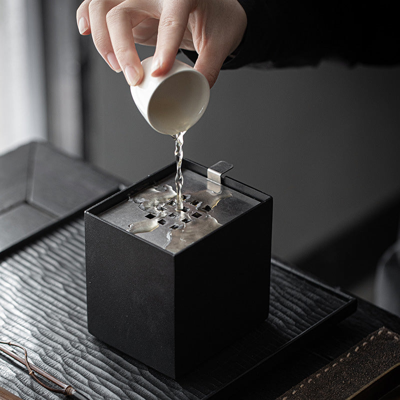 Pouring water into tea bowl