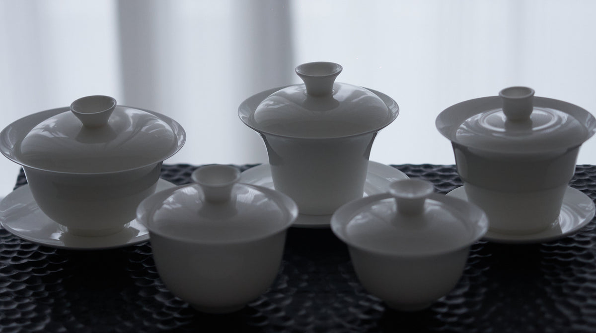 Bone china gaiwan collection in backlighting showing the silhouettes