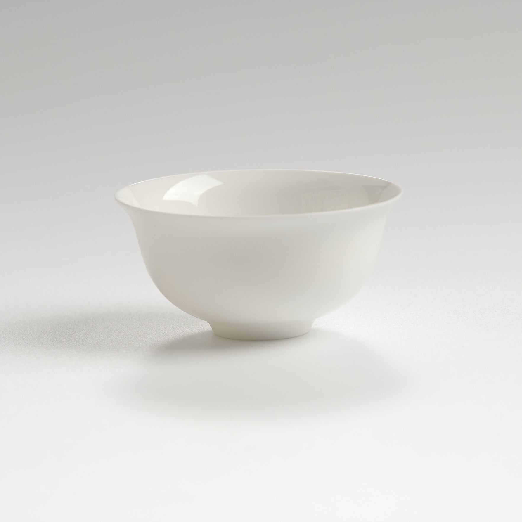 Bone china inverted-rim tasting cup, front eye-level view