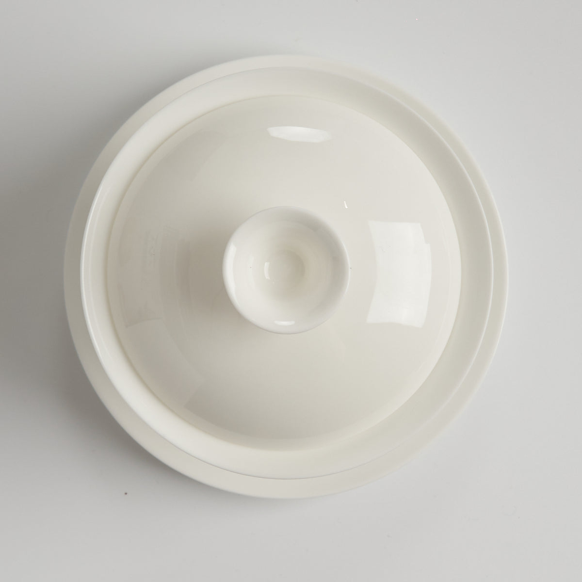 Translucent bone china trumpet-rim gaiwan, top-down closed view