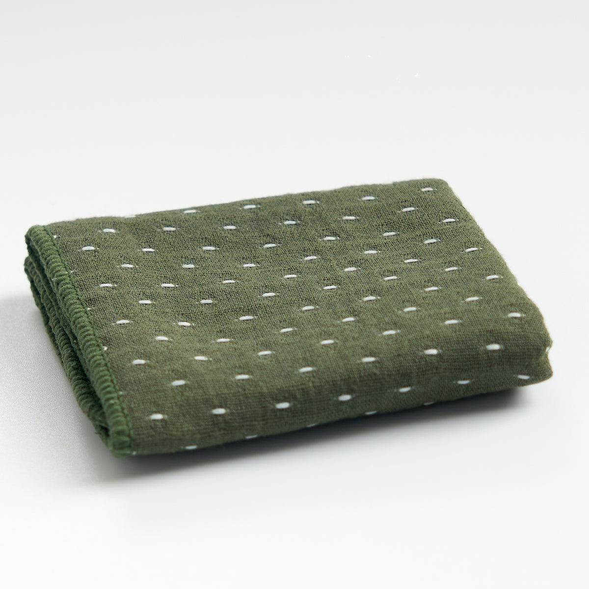 Thick cotton-linen tea towel in green, folded product view