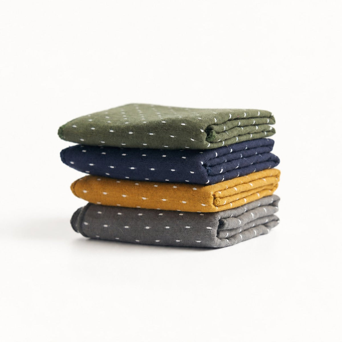 Thick cotton-linen tea towels in gray, yellow, blue, and green, stacked front view