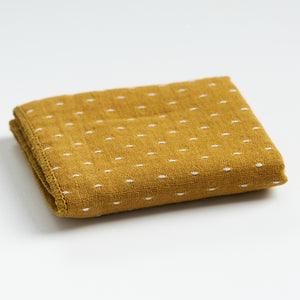 Thick cotton-linen tea towel in yellow, folded product view