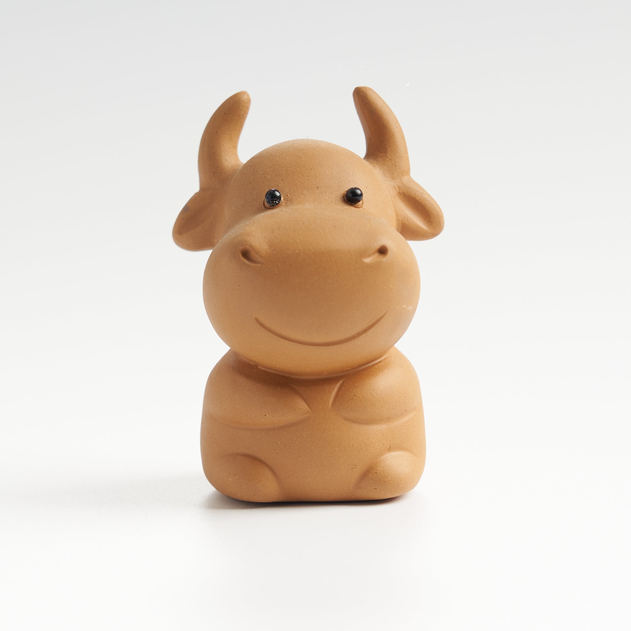 Cute sculpted ox tea pet, front eye-level view