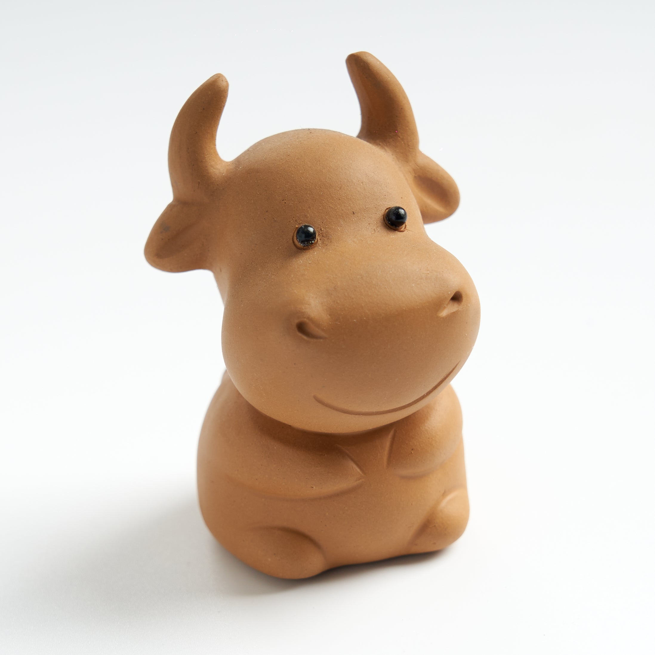 Cute sculpted ox tea pet, three-quarter view