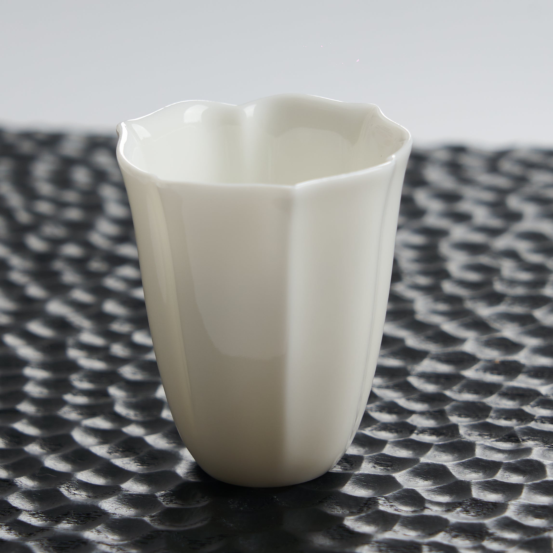 Faceted White Porcelain Tea Cup — styled tea setting