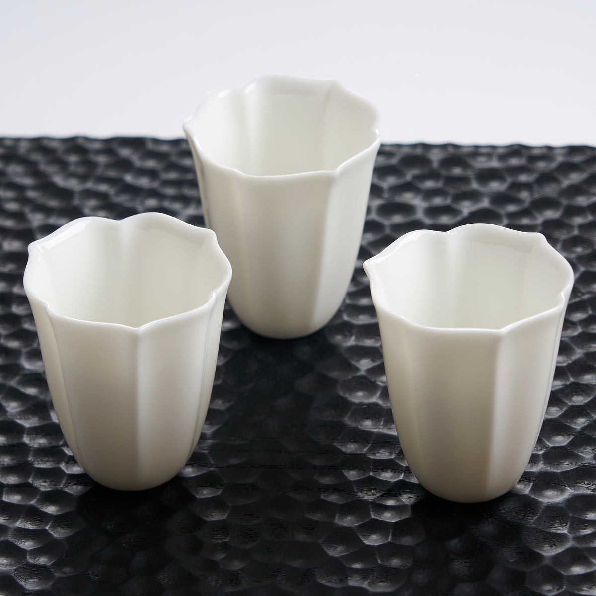 Faceted White Porcelain Tea Cup — styled tea setting