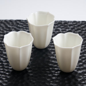 Faceted White Porcelain Tea Cup — styled tea setting