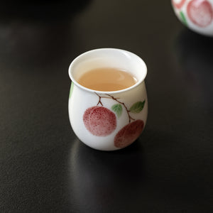 Hand-Painted Lychee Tasting Cup in a tea setting