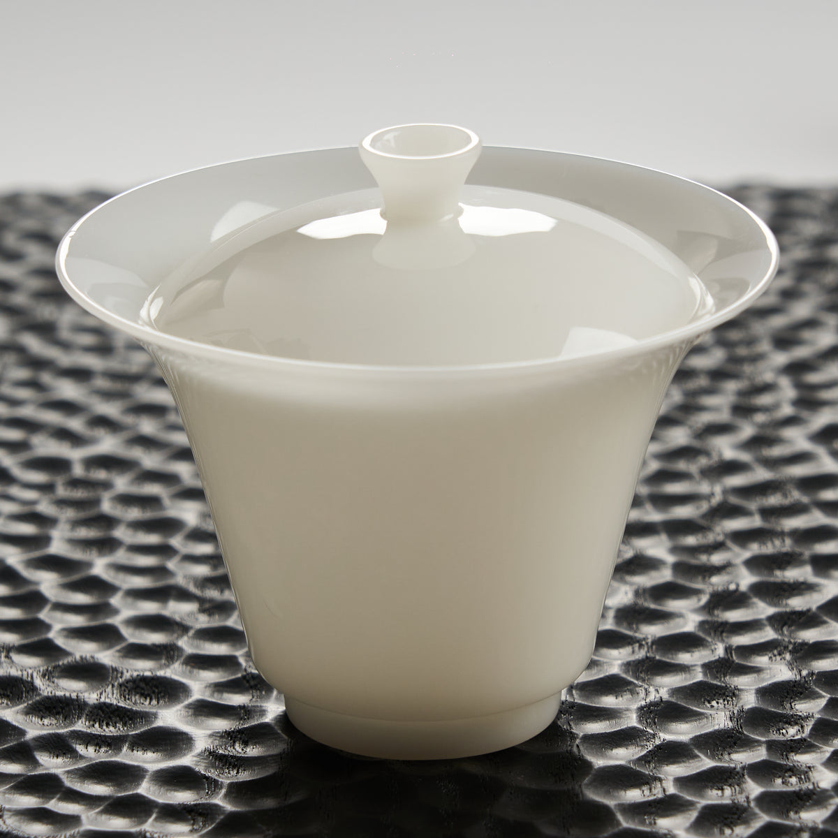 Ice Jade Porcelain Gaiwan — tall 100 ml style on a dark textured tea tray