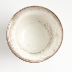 Rustic speckled stoneware teacup set, top-down glaze detail