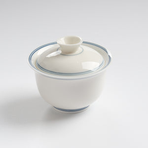 Sheep-fat white porcelain blue-rim evaluation gaiwan, slightly overhead wide view