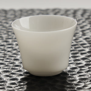Translucent White Porcelain Tea Cup — styled tea setting