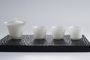 Translucent White Porcelain Tea Cup — styled tea setting