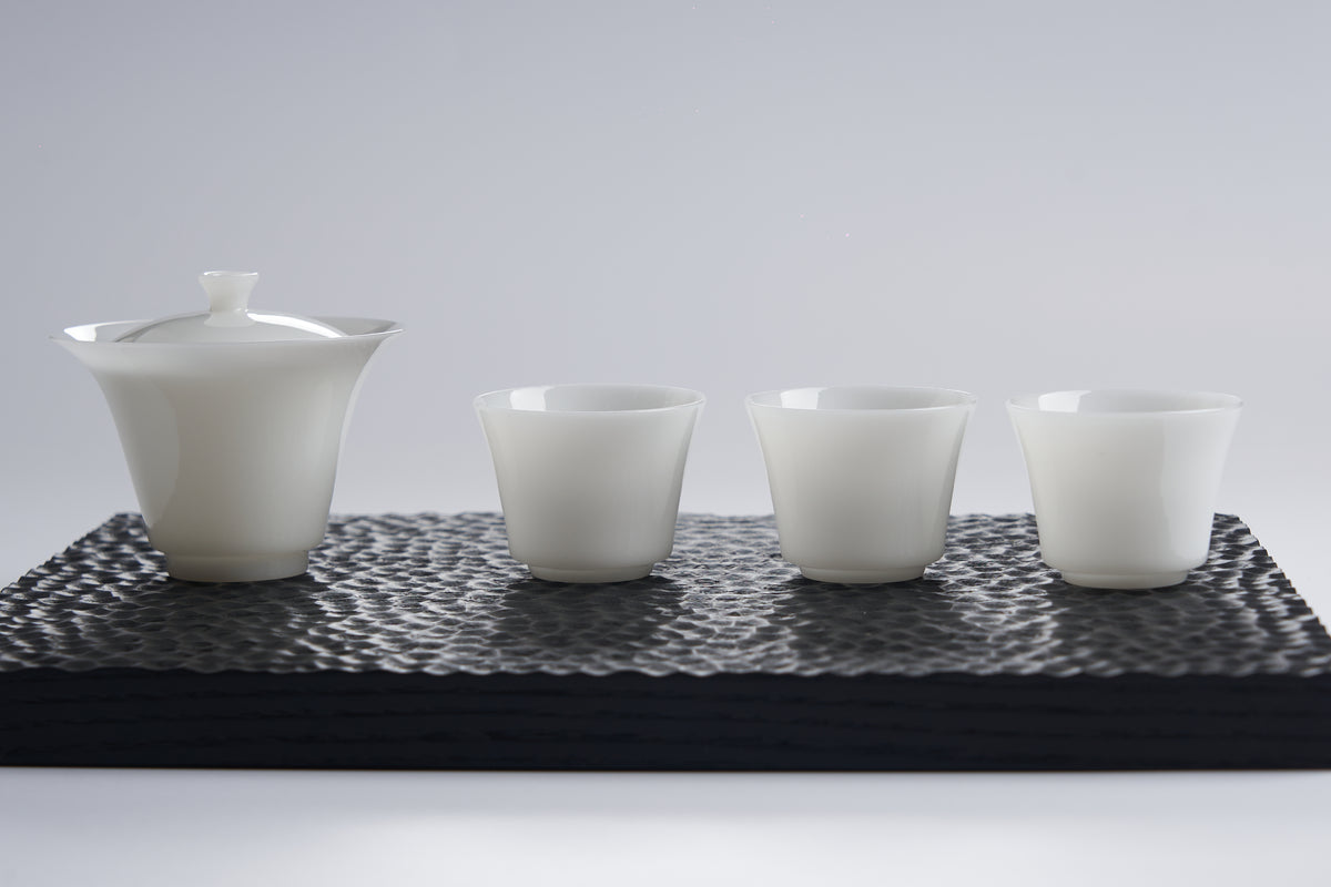 Translucent White Porcelain Tea Cup — styled tea setting