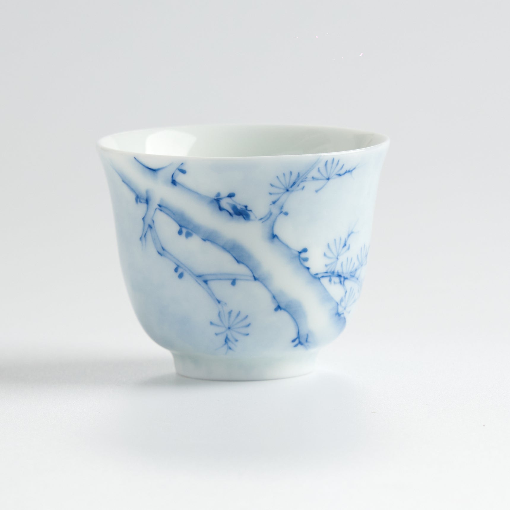 Underglaze Blue-and-White Hand-Painted Pine Cup — front view