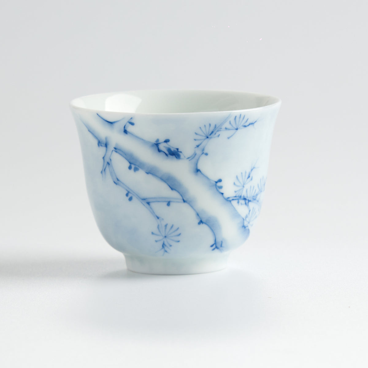 Underglaze Blue-and-White Hand-Painted Pine Cup — front view