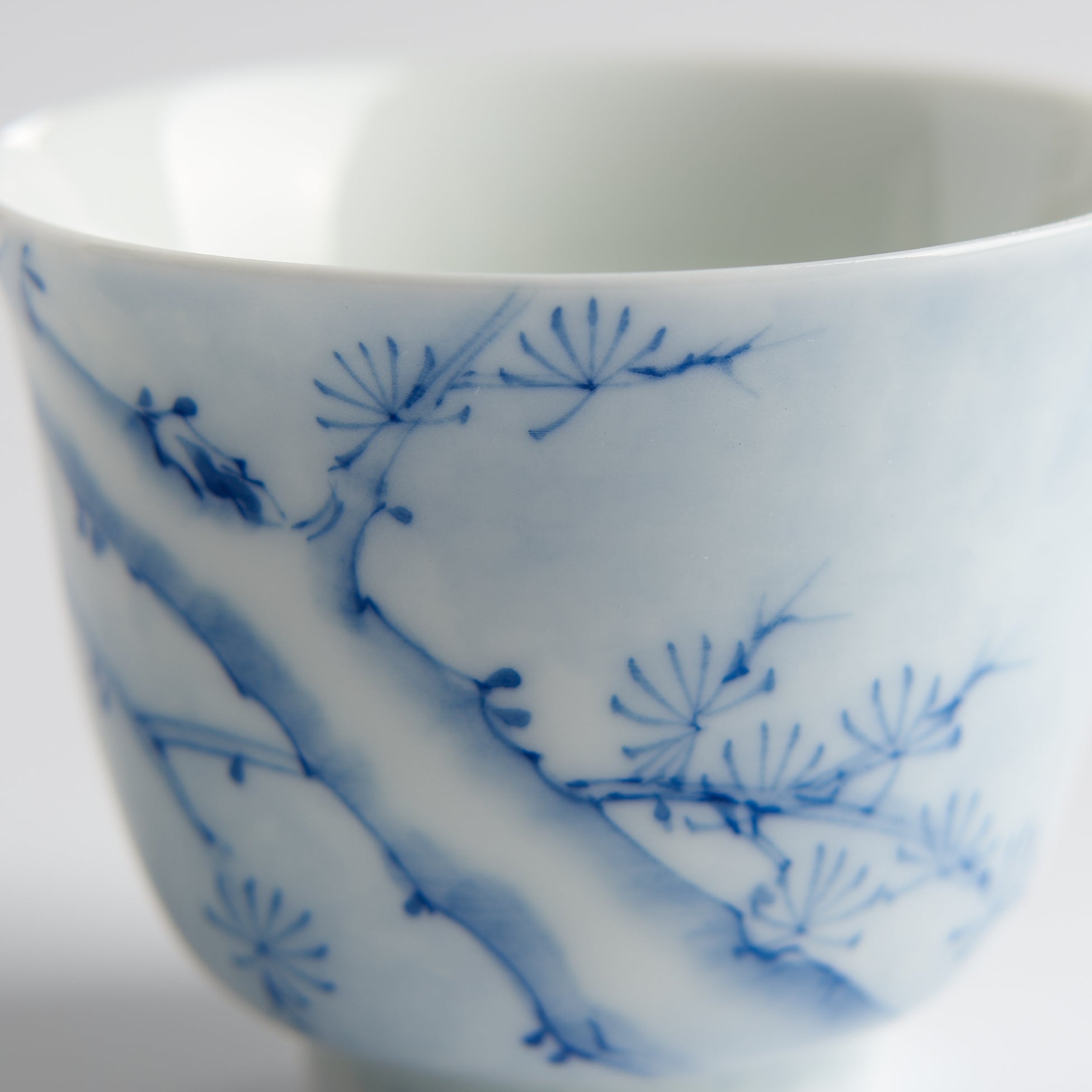 Underglaze Blue-and-White Hand-Painted Pine Cup — painted detail